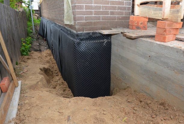 Happy homeowners after waterproofing job in Maplesville